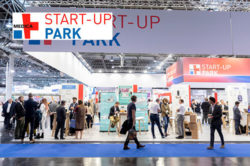 Image: Picture of a joint stand, next to it the logo of the MEDICA START-UP PARK; Copyright: Messe Düsseldorf