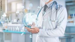 Depiction of a doctor with medical symbols floating in the air around the word “AI” – AI in healthcare; Copyright: AndersonPiza