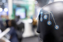 A mannequin's head with a wearable device on its forehead