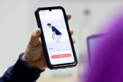 Smartphone with a health app that demonstrates a rehabilitation exercise